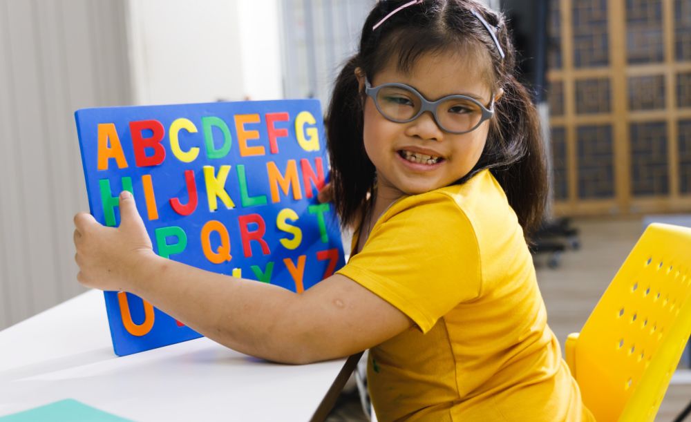 Image of a child with Down syndrome (trisomy 21) showing common down syndrome symptoms. The down syndrome test helps diagnose down disease early for better support.